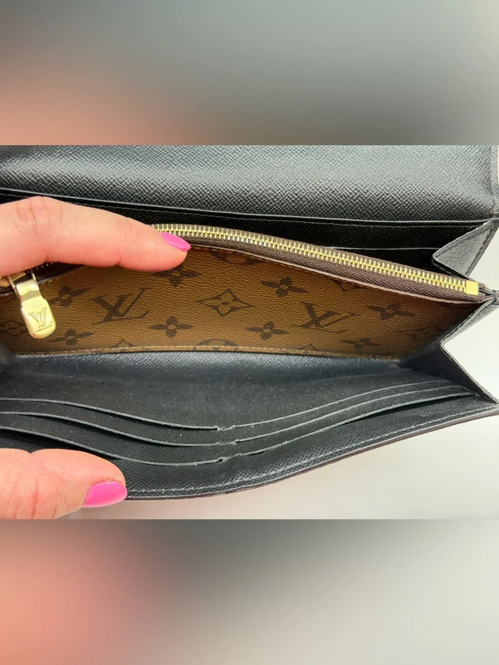 Louis Vuitton Sarah wallet in reverse monogram